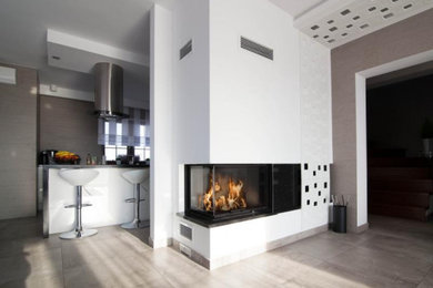 Inspiration for a mid-sized transitional dining room remodel in Bridgeport with a corner fireplace and a plaster fireplace