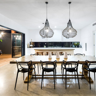Design ideas for a contemporary kitchen/dining combo in Adelaide with white walls, concrete floors and grey floor.