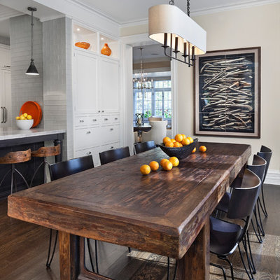 Example of a transitional dark wood floor and brown floor kitchen/dining room combo design in Chicago with beige walls