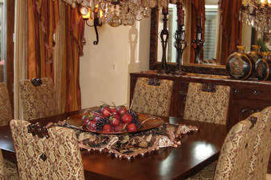 Example of a tuscan dining room design in Orange County