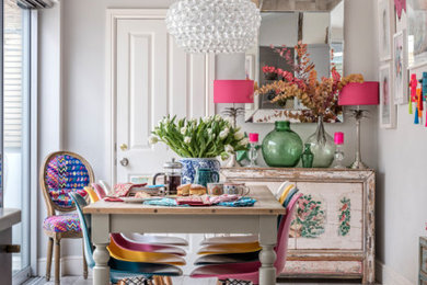 This is an example of an eclectic dining room in London.