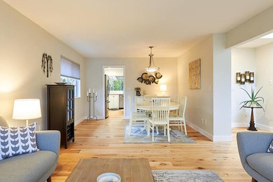 Great room - mid-sized transitional light wood floor and beige floor great room idea in Vancouver with gray walls and no fireplace