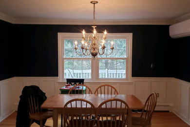 Example of a country dining room design in New York