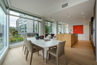 Kitchen/dining room combo - mid-sized modern light wood floor kitchen/dining room combo idea in Vancouver