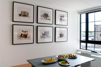 Medium sized contemporary open plan dining room in London.