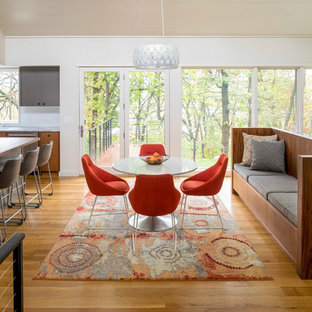 Trendy medium tone wood floor and brown floor great room photo in Minneapolis with white walls