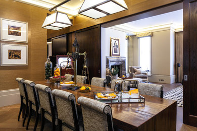 Inspiration for a medium sized traditional dining room in London with brown floors.
