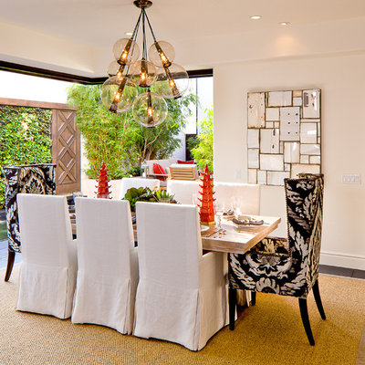 Inspiration for a mid-sized mediterranean slate floor dining room remodel in Orange County with white walls and no fireplace