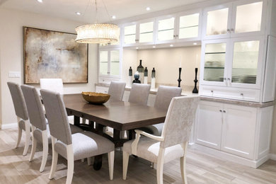Example of a trendy light wood floor and beige floor dining room design in Sacramento with no fireplace