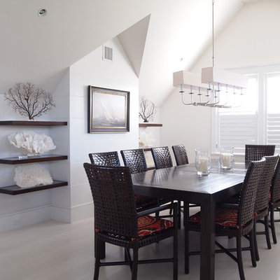 Inspiration for a large coastal light wood floor and beige floor enclosed dining room remodel in Boston with white walls and no fireplace