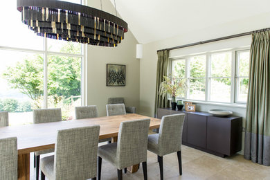 This is an example of a contemporary dining room in Gloucestershire.