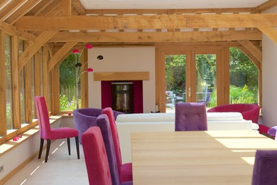 This is an example of a contemporary dining room in West Midlands.