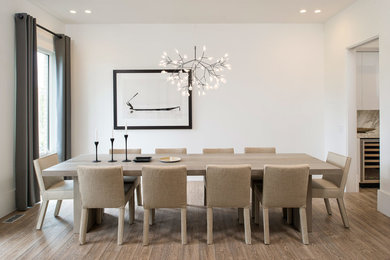 Mid-sized danish light wood floor dining room photo in DC Metro with white walls