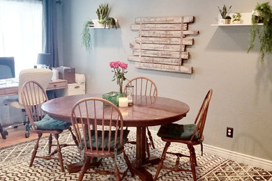 Example of an eclectic dining room design in Denver
