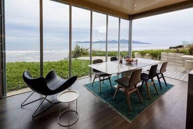 Example of a mid-sized beach style kitchen/dining room combo design in Auckland