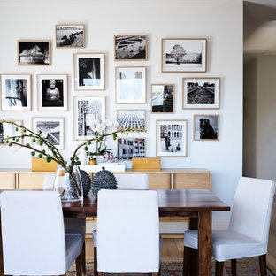 Inspiration for a transitional dining room in Melbourne with white walls, light hardwood floors and brown floor.