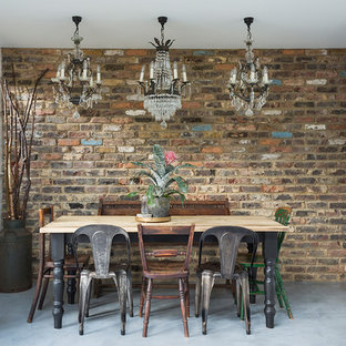 Idee per una sala da pranzo eclettica di medie dimensioni e chiusa con pareti bianche, pavimento in cemento e pavimento grigio