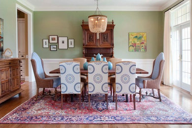 Inspiration for a timeless medium tone wood floor dining room remodel in Philadelphia with green walls