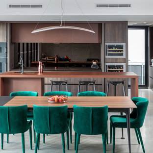 This is an example of a mid-sized contemporary open plan dining in Perth with white walls, concrete floors and grey floor.