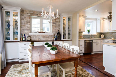 Example of a classic medium tone wood floor kitchen/dining room combo design in Philadelphia with beige walls