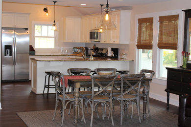 Trendy medium tone wood floor great room photo in Other with white walls