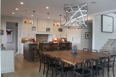 Transitional light wood floor and brown floor kitchen/dining room combo photo in Cedar Rapids with gray walls