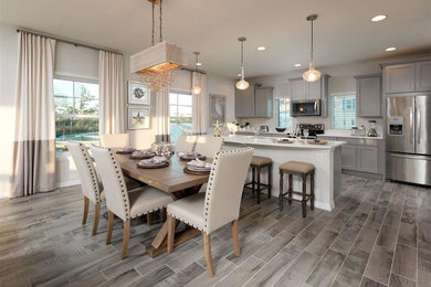 Example of a mid-sized transitional porcelain tile and gray floor kitchen/dining room combo design in DC Metro with gray walls