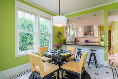 Example of a large eclectic ceramic tile and multicolored floor kitchen/dining room combo design in Minneapolis with green walls