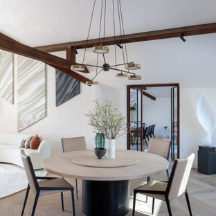 Photo of a contemporary open plan dining room in Other with white walls, medium hardwood flooring, no fireplace, brown floors and exposed beams.