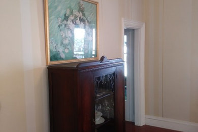 Mid-sized elegant dark wood floor kitchen/dining room combo photo in Portland Maine with beige walls