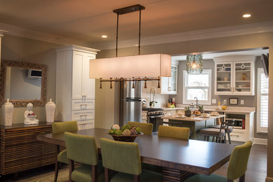 Enclosed dining room - mid-sized traditional medium tone wood floor and brown floor enclosed dining room idea in Other with beige walls