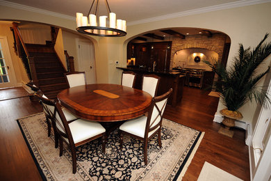 Inspiration for an eclectic dark wood floor dining room remodel in Milwaukee with beige walls