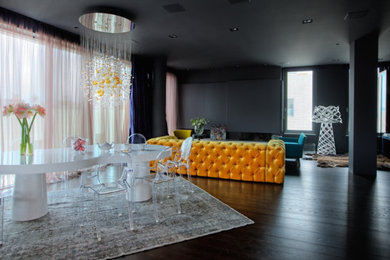 Photo of a contemporary open plan dining room in Moscow with black walls and dark hardwood flooring.