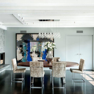 Idée de décoration pour une salle à manger urbaine avec une cheminée d'angle.