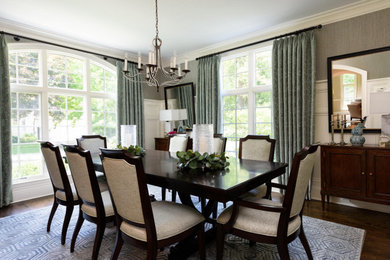 Example of a classic light wood floor dining room design in Chicago with blue walls