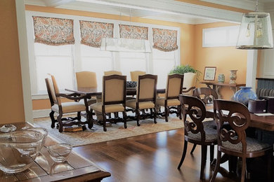 Dining room - mid-sized traditional medium tone wood floor and brown floor dining room idea in New York