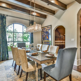 Inspiration for a mediterranean medium tone wood floor and brown floor dining room remodel in Houston with beige walls and no fireplace