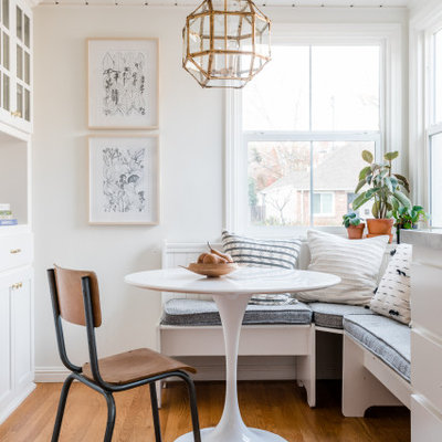 Kitchen/dining room combo - mid-sized scandinavian medium tone wood floor and brown floor kitchen/dining room combo idea in Sacramento with white walls