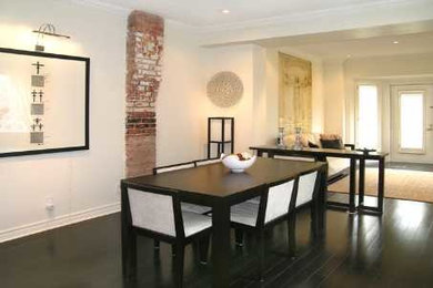 Great room - mid-sized modern dark wood floor and black floor great room idea in Toronto with white walls and no fireplace