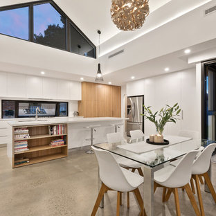 Inspiration for a country kitchen/dining combo in Perth with white walls, concrete floors and grey floor.
