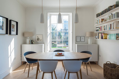 This is an example of a large contemporary dining room in London.
