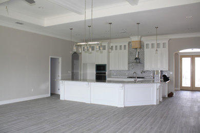 Example of a porcelain tile and gray floor kitchen/dining room combo design in Austin
