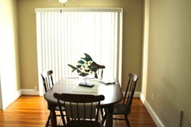 Mid-sized medium tone wood floor kitchen/dining room combo photo in Other with beige walls and no fireplace