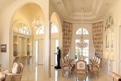 Photo of a classic open plan dining room in Miami with concrete flooring.