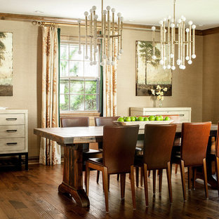 Dining room - 1950s dark wood floor dining room idea in New York with a standard fireplace and a stone fireplace