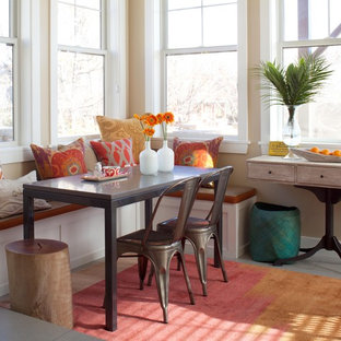 Example of an eclectic dining room design in Denver with beige walls