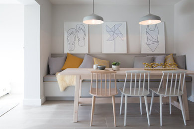 This is an example of a scandinavian dining room in Surrey.