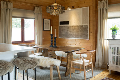 Inspiration for a small rustic open plan dining room in Buckinghamshire with light hardwood flooring.