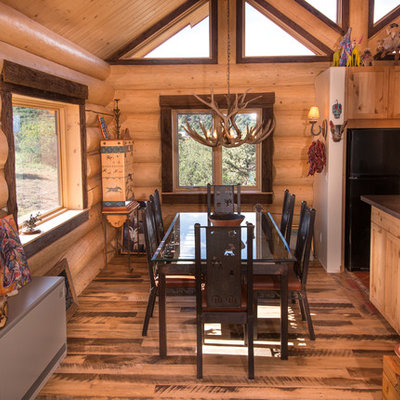 Inspiration for a mid-sized rustic medium tone wood floor and beige floor kitchen/dining room combo remodel in Salt Lake City with beige walls and no fireplace