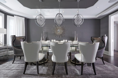 Inspiration for a large transitional dark wood floor enclosed dining room remodel in Toronto with gray walls